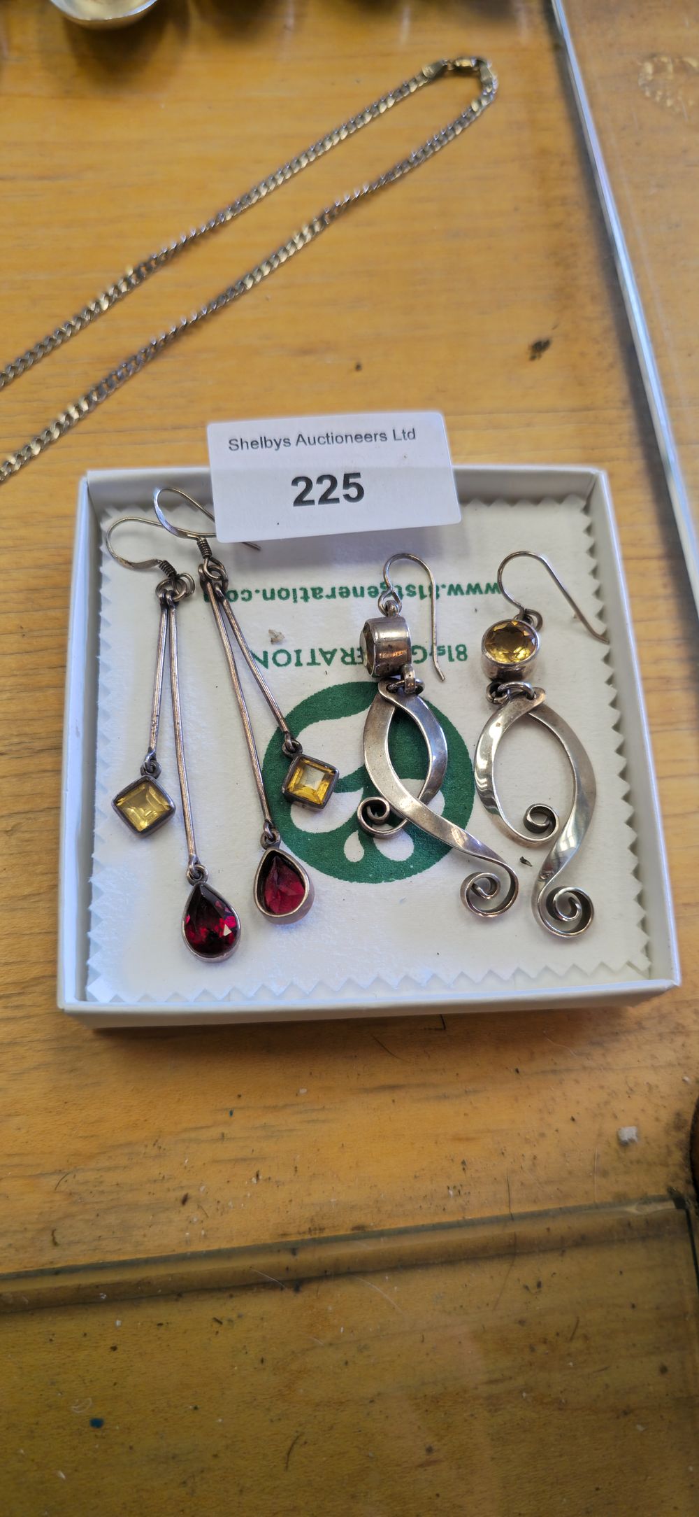 Lot 225: Two pairs of ladies, inset, large, silver earrings