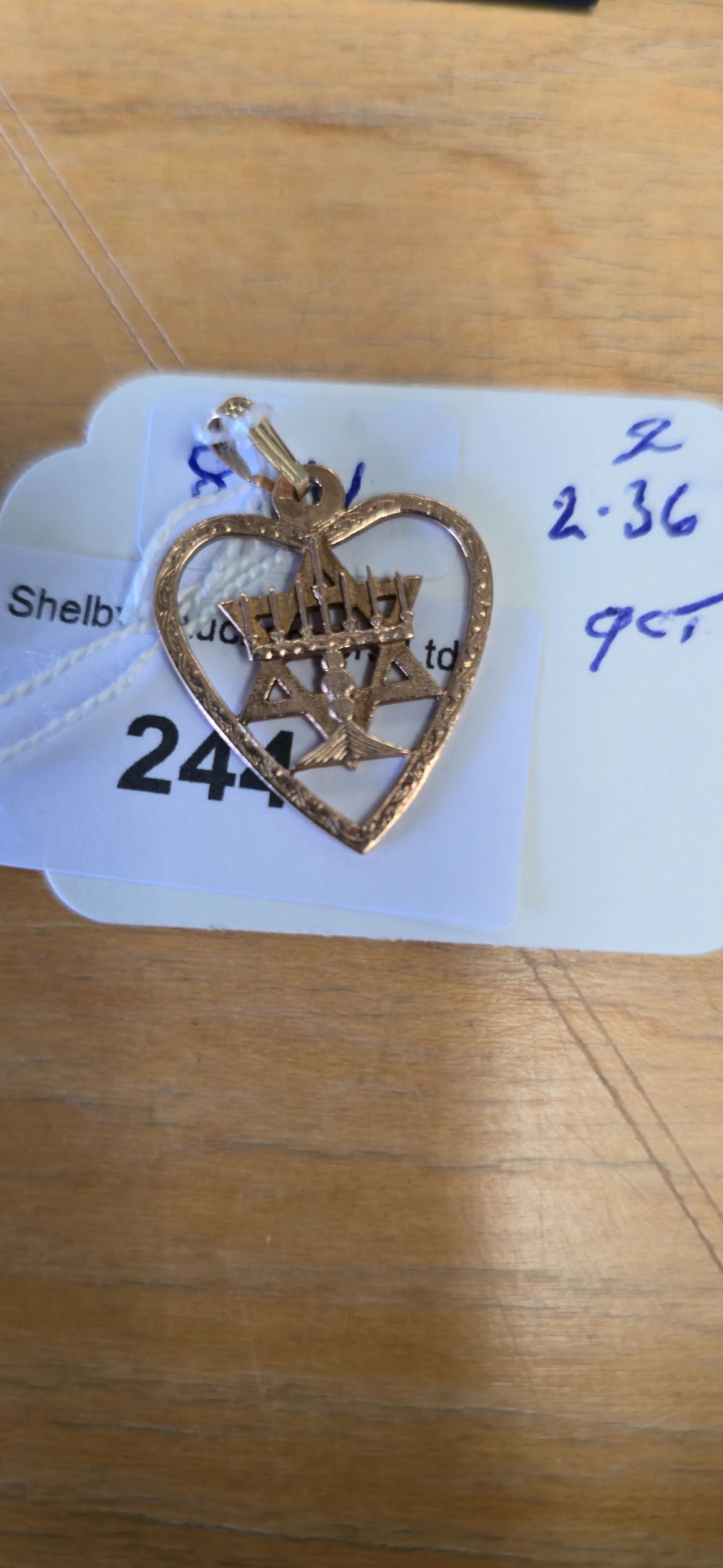 Lot 244: 9 carat gold menorah, Jewish heart, pendant 2.36...