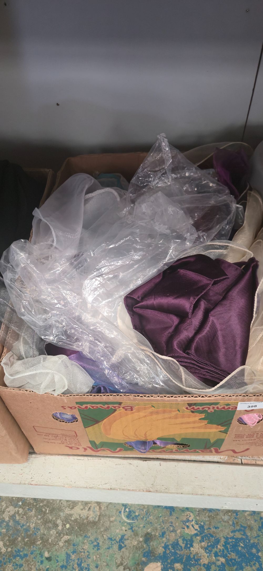 Lot 398: Box containing various coloured chair, tiebacks