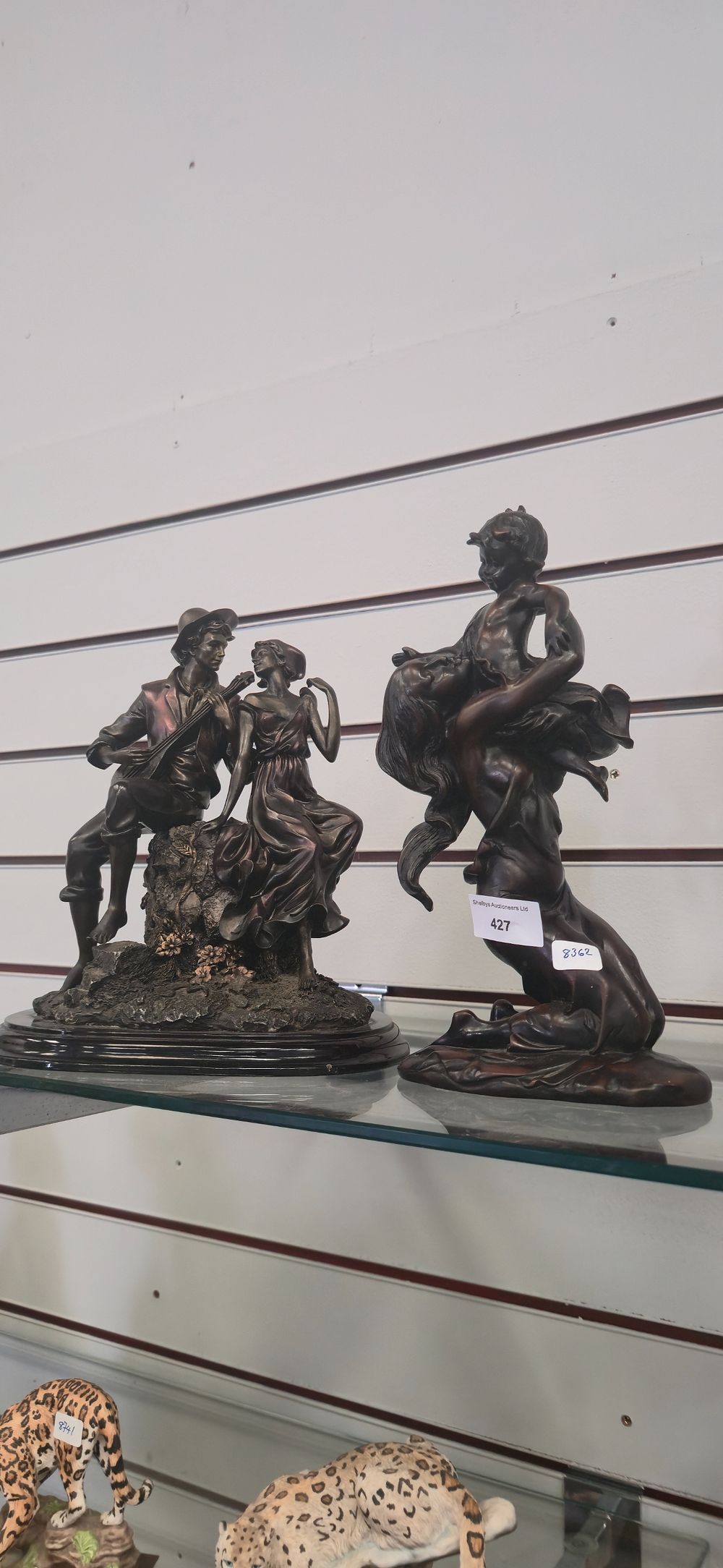 Lot 427: Pair of resin figures, mother and child, with...