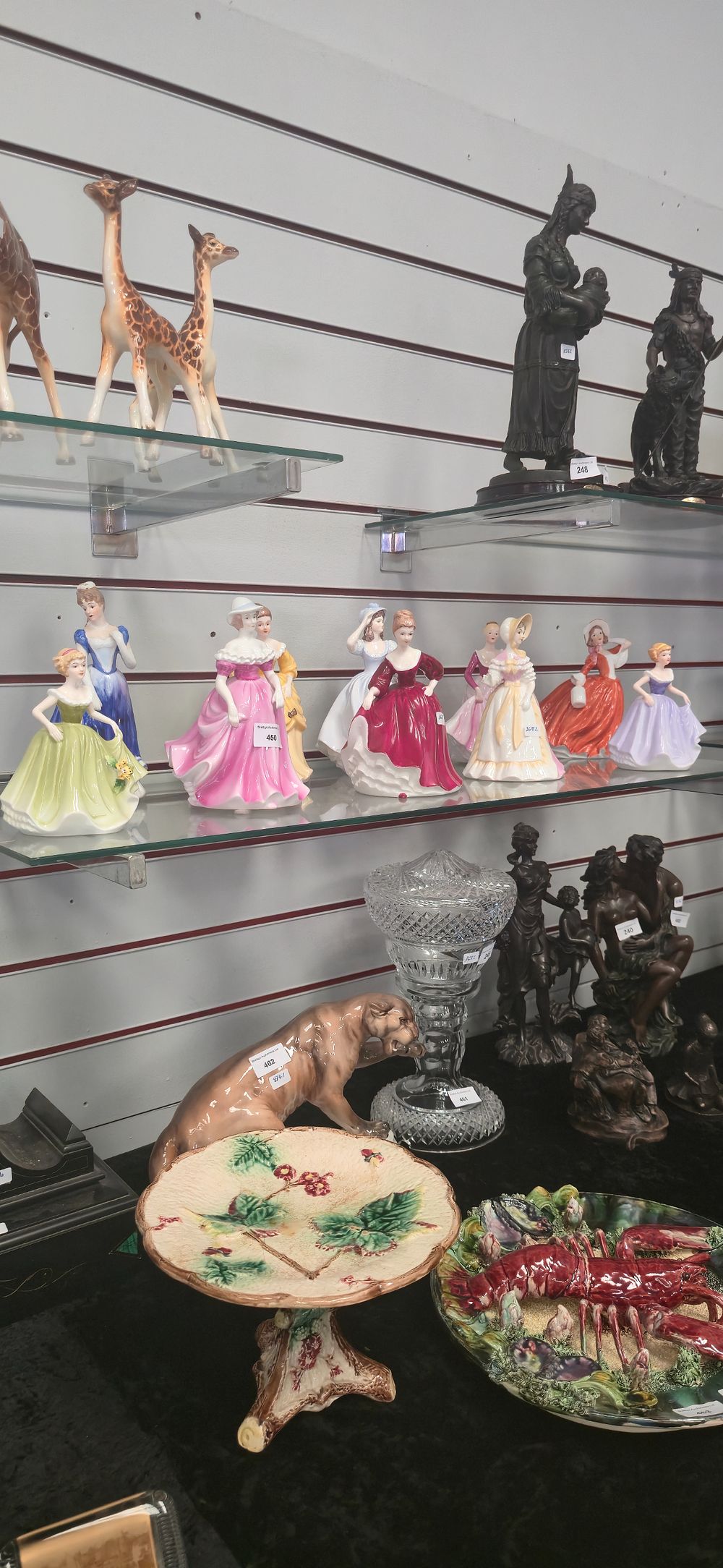 Lot 450: 10. Various pottery lady figurines.