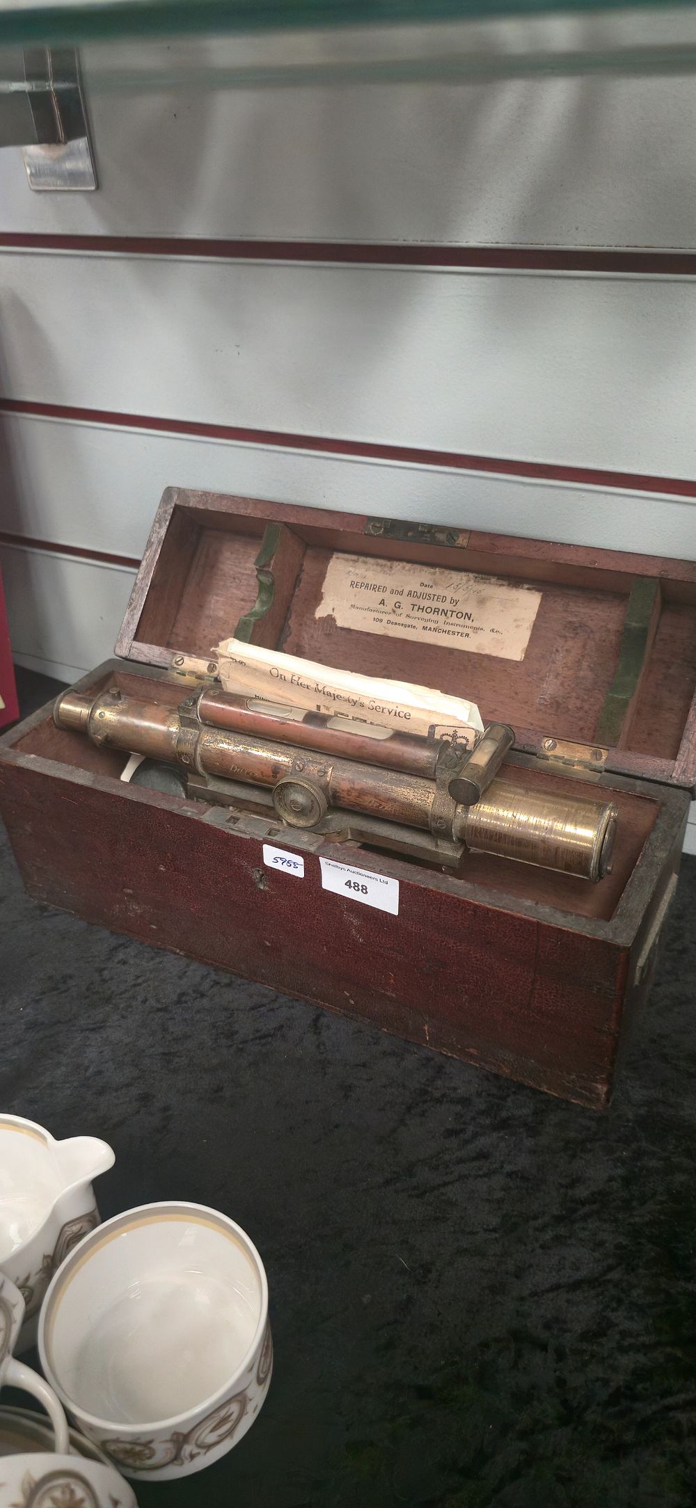Lot 488: Antique brass surveyors level in wooden case