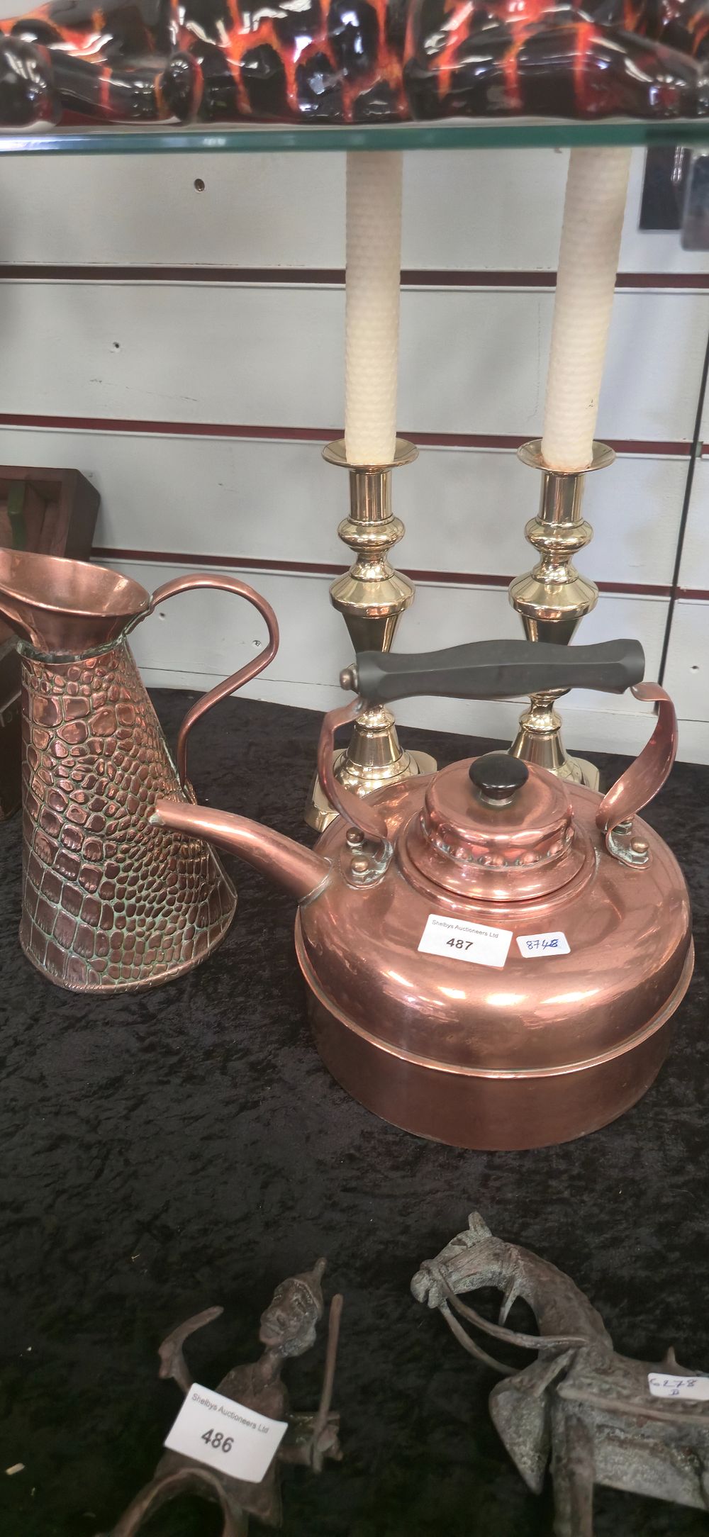 Lot 487: Copper kettle with copper jug and brass candlesticks