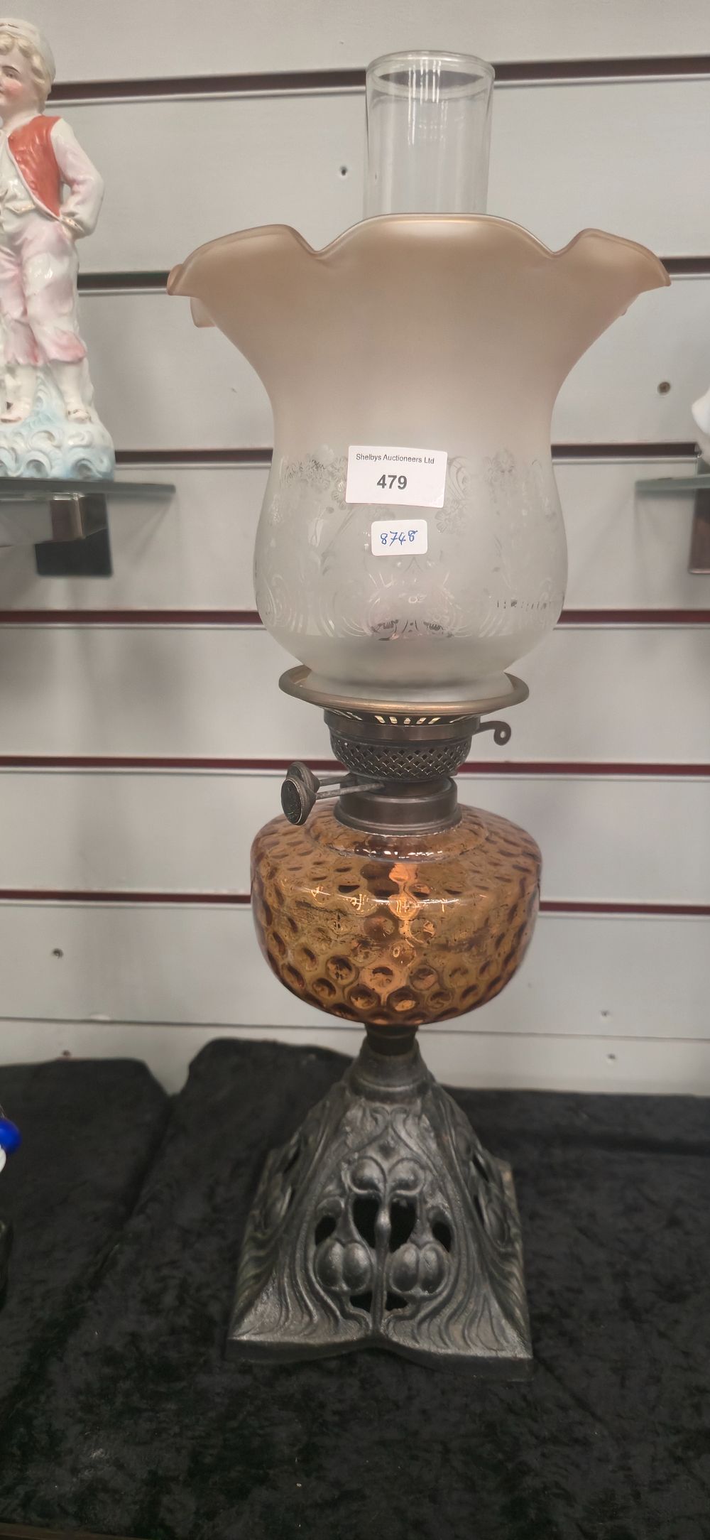 Lot 479: Edwardian metal base, amber glass, paraffin lamp