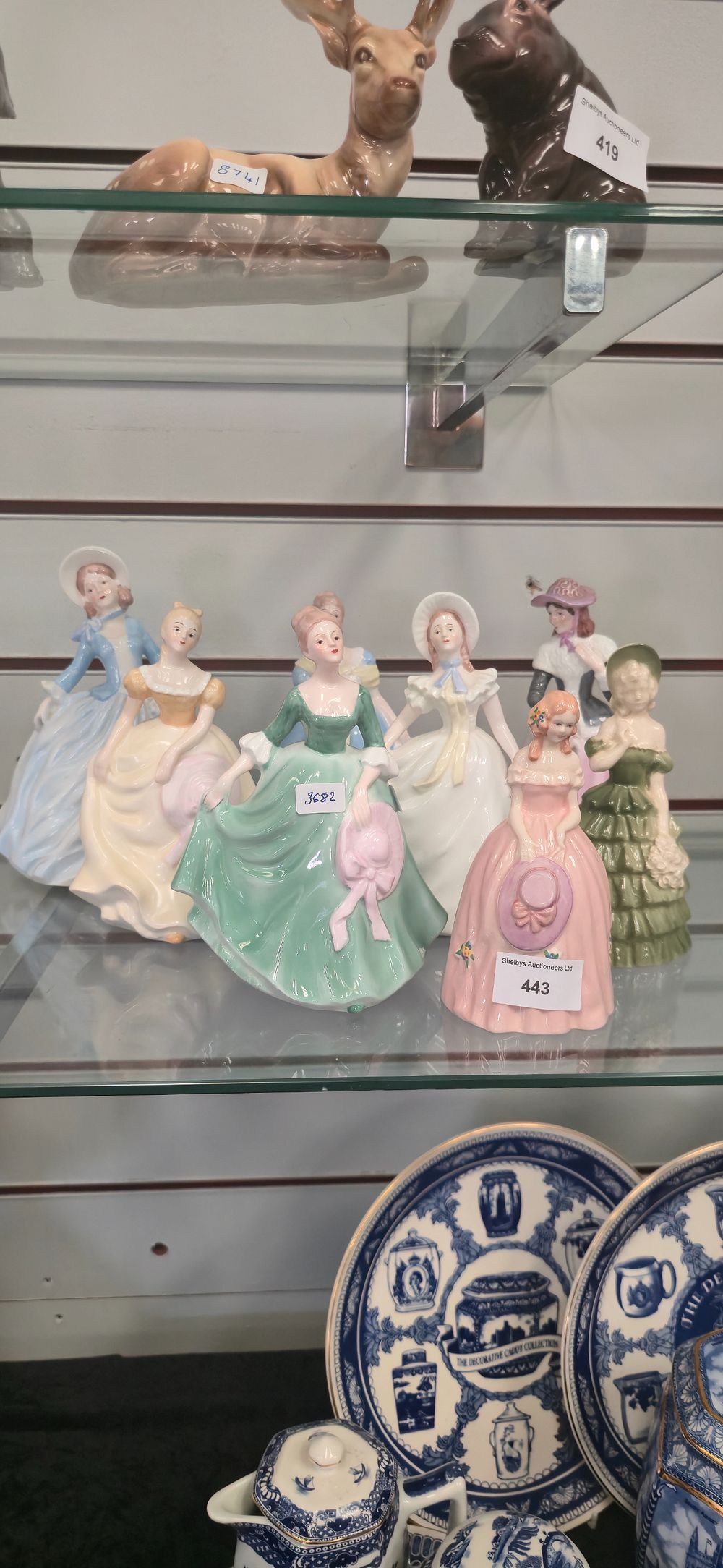 Lot 443: Eight. Various porcelain lady figurines.