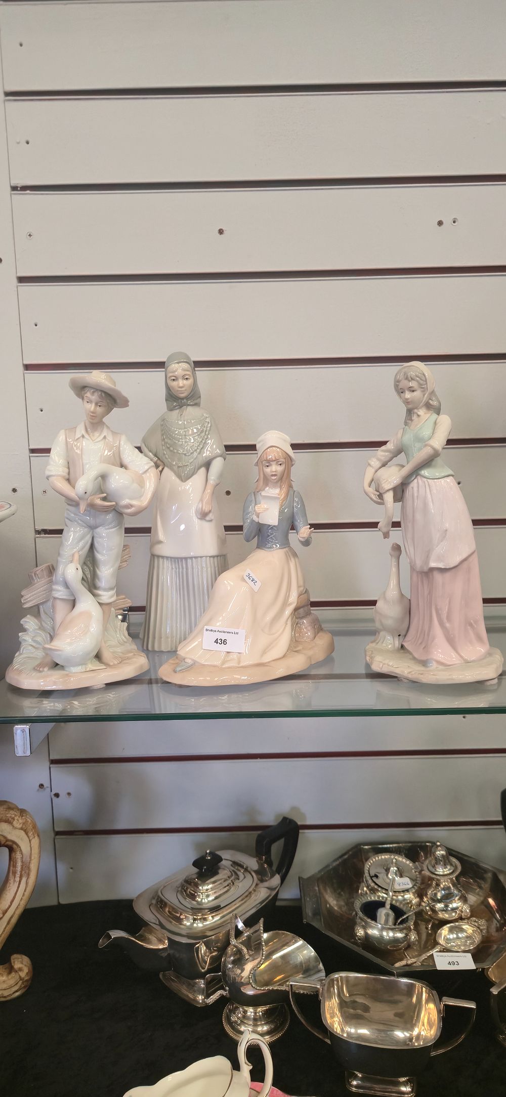Lot 436: Four large, porcelain lady, figurines
