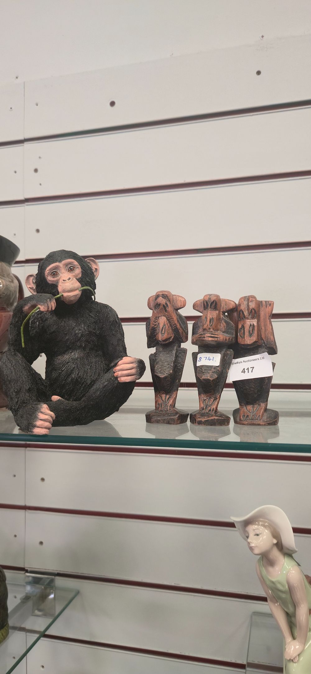 Lot 417: Three wooden monkeys with country artist chimp playing...