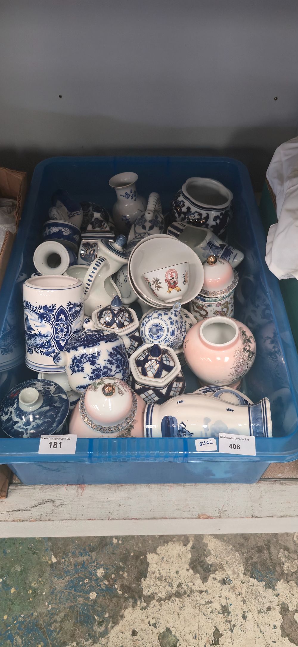 Lot 406: Box containing large amount of blue-and-white, wear pottery...