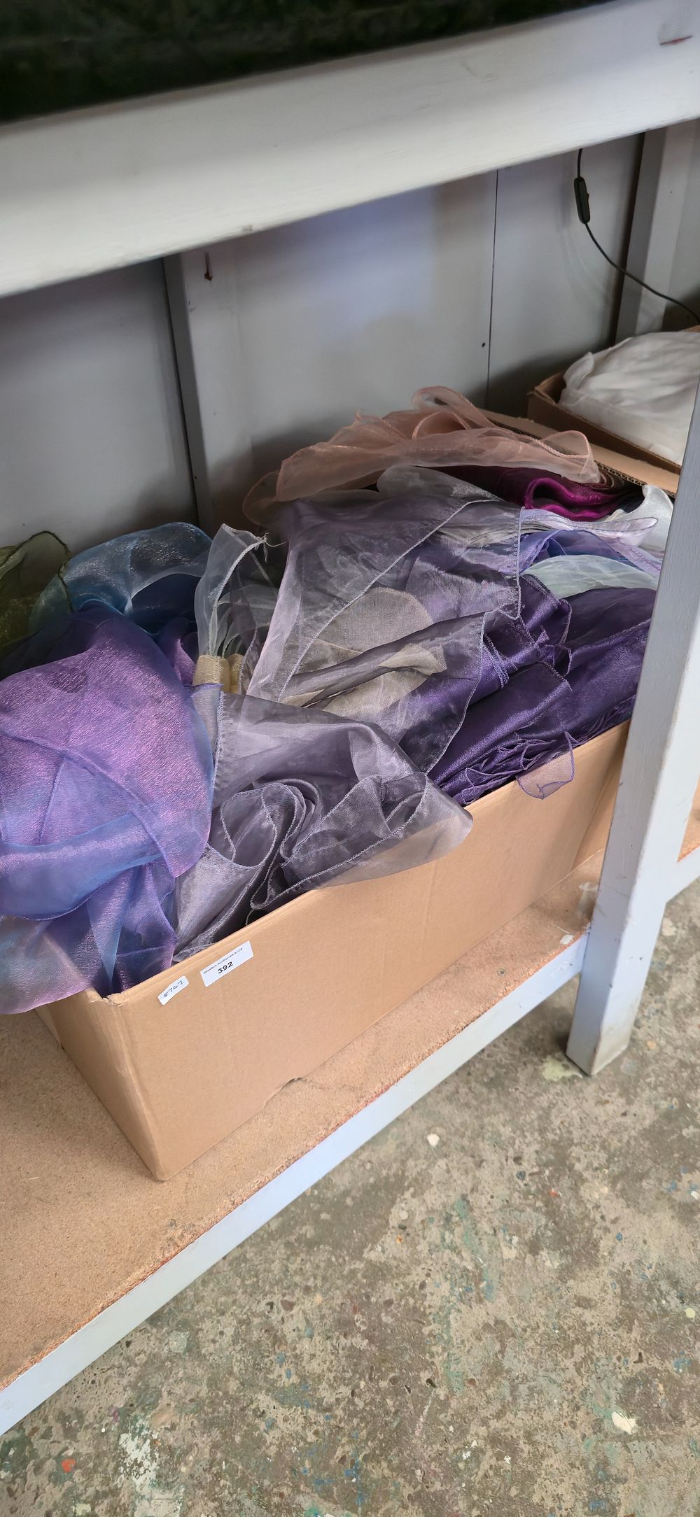 Lot 392: Box containing various coloured chair, tiebacks, purples, grey...