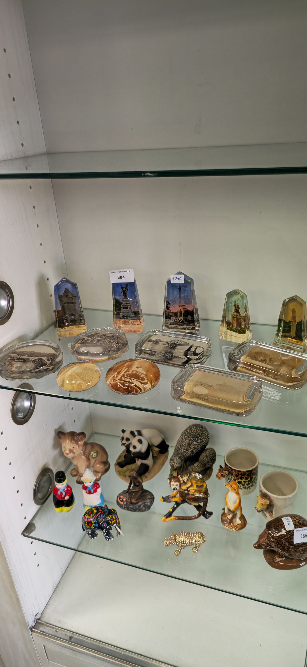 Lot 384: Selection of various photographic paper weights with tourist,...
