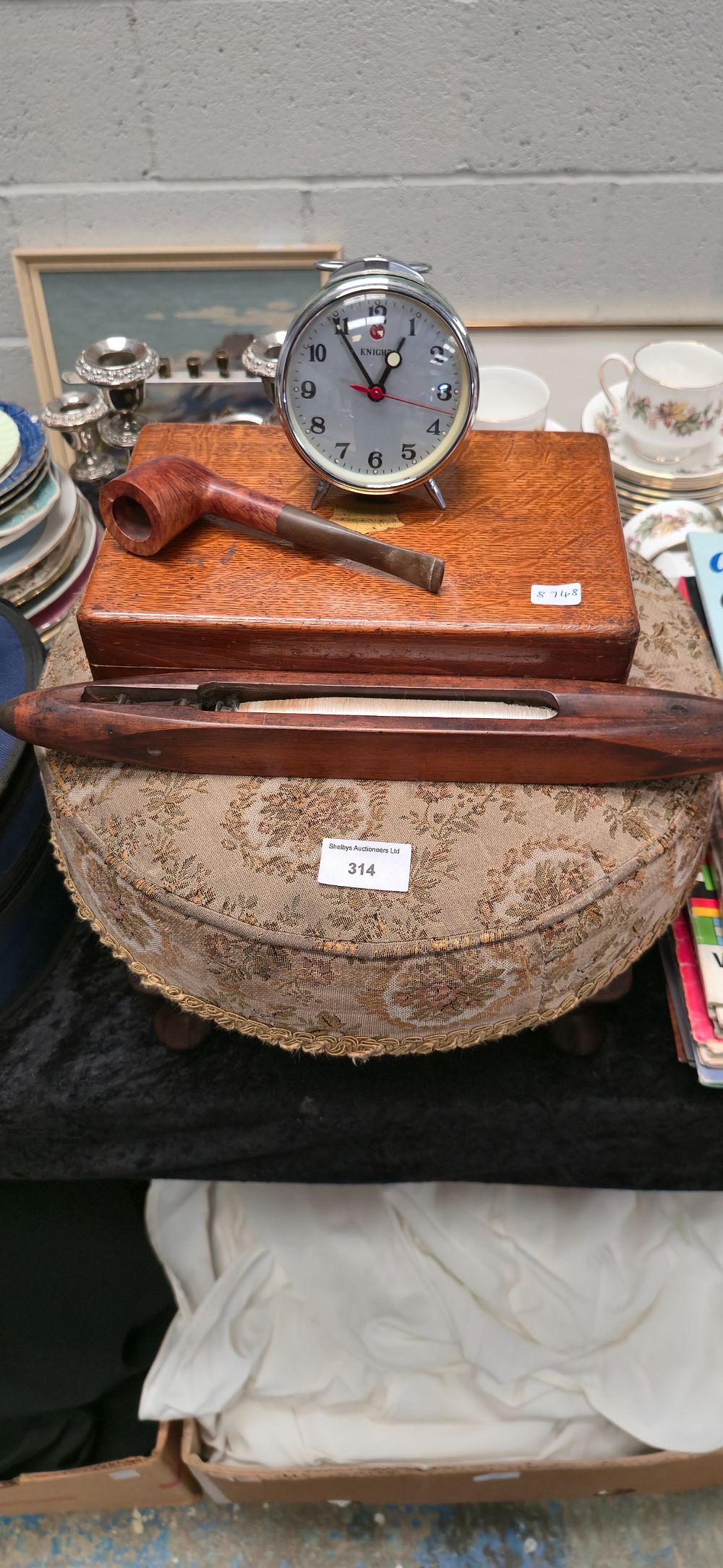Lot 314: Small footstool with wooden bobbin, smokers pipe, wooden...