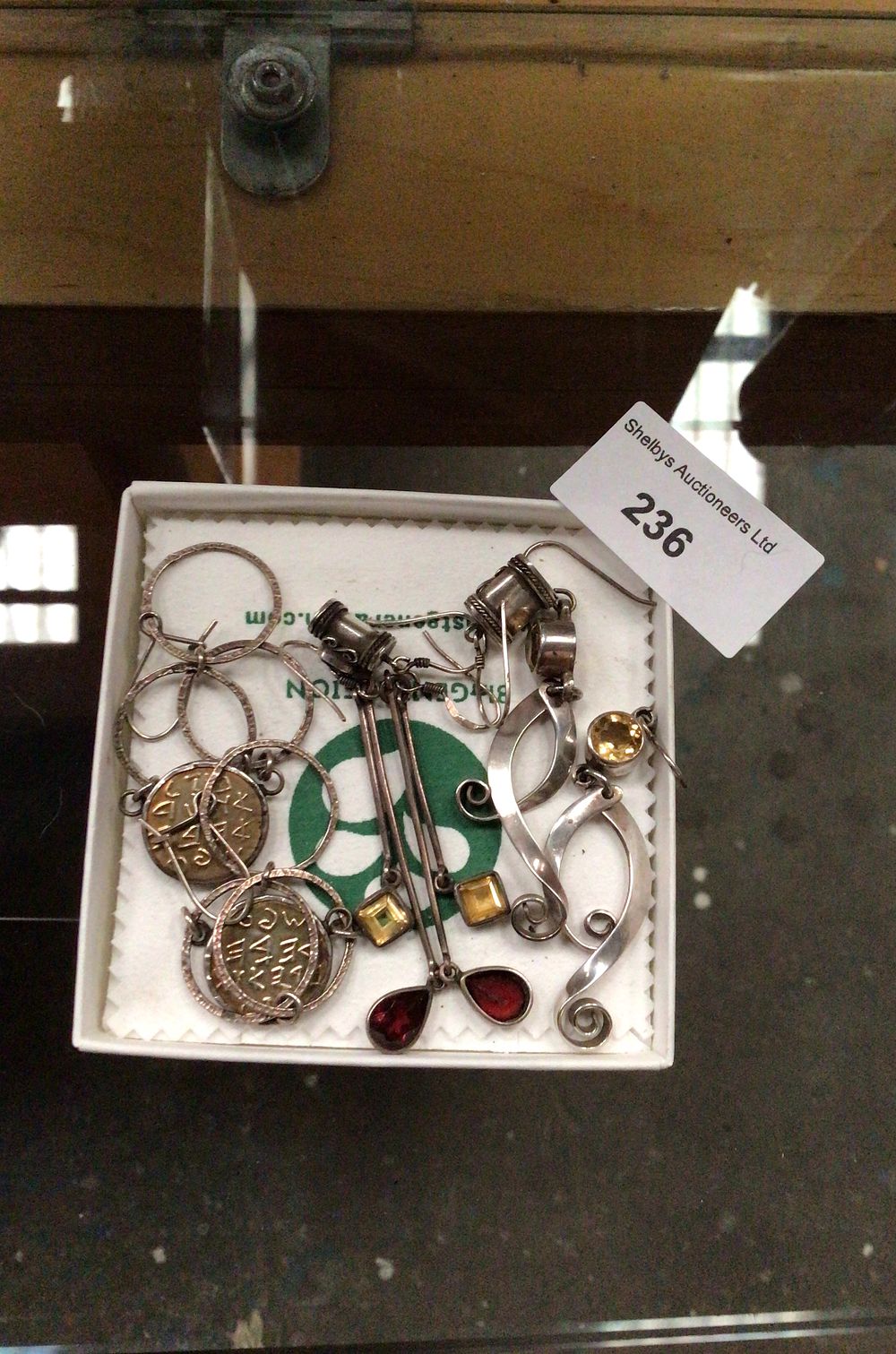 Lot 236: Collection of Silver-Toned Modernistic Jewelry with Gemstone Accents