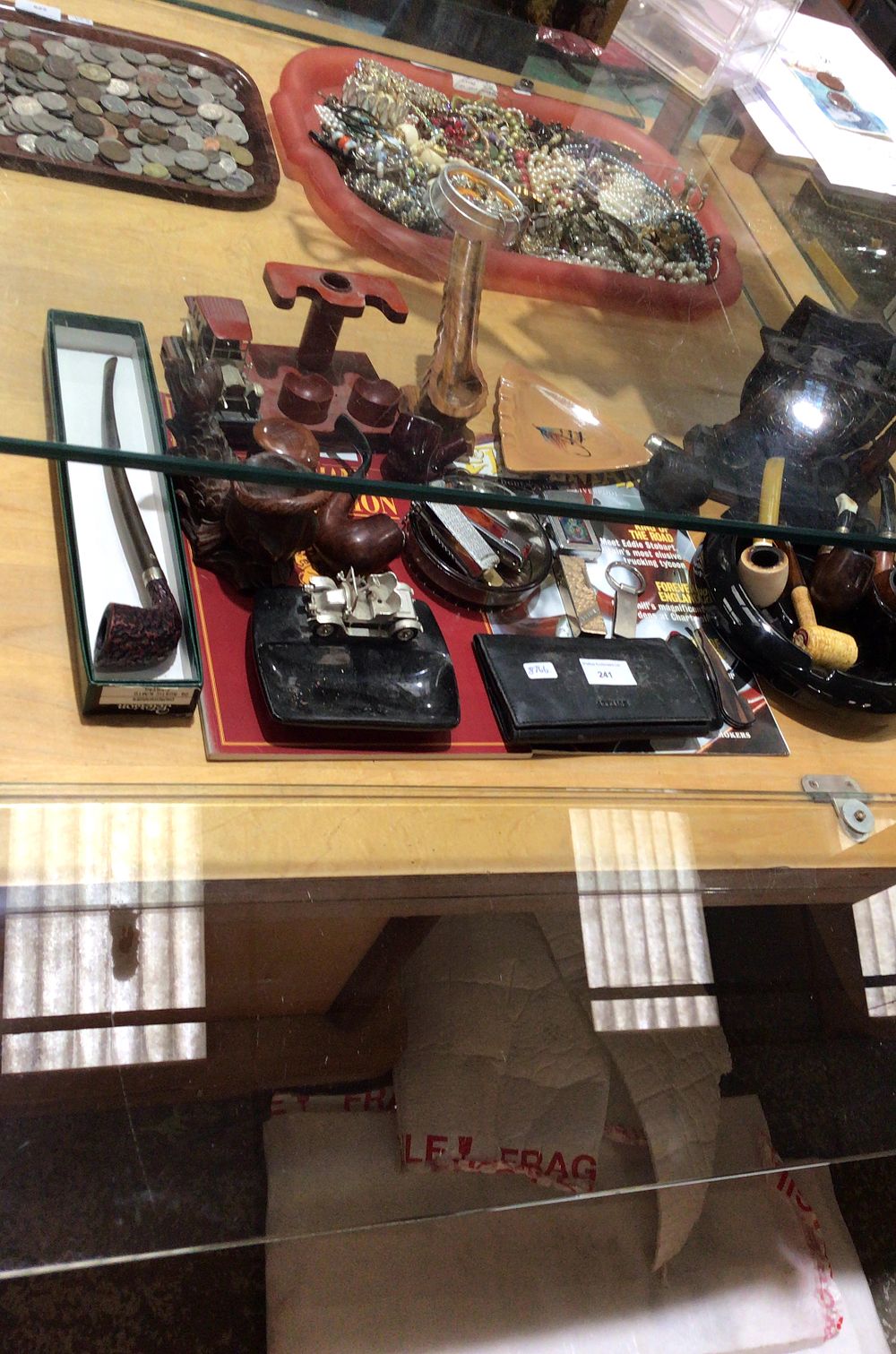 Lot 241: Collection of Smoking Pipes, Lighters, and Tobacciana Accessories