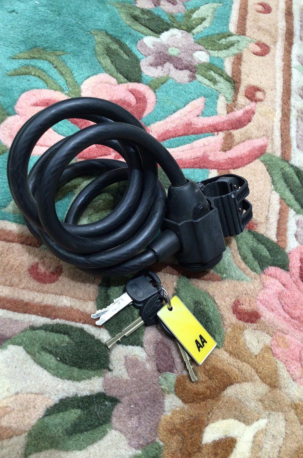 Lot 259: NINETY ONE Black Spiral Cable Lock with Keys and Bracket