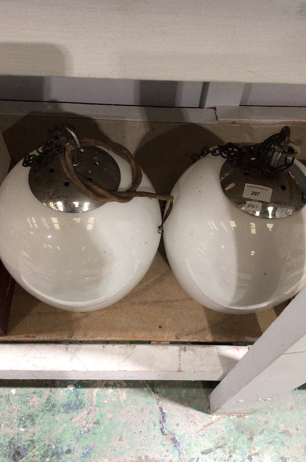 Lot 297: Pair of Mid-20th Century Opaline Globe Pendant Lights