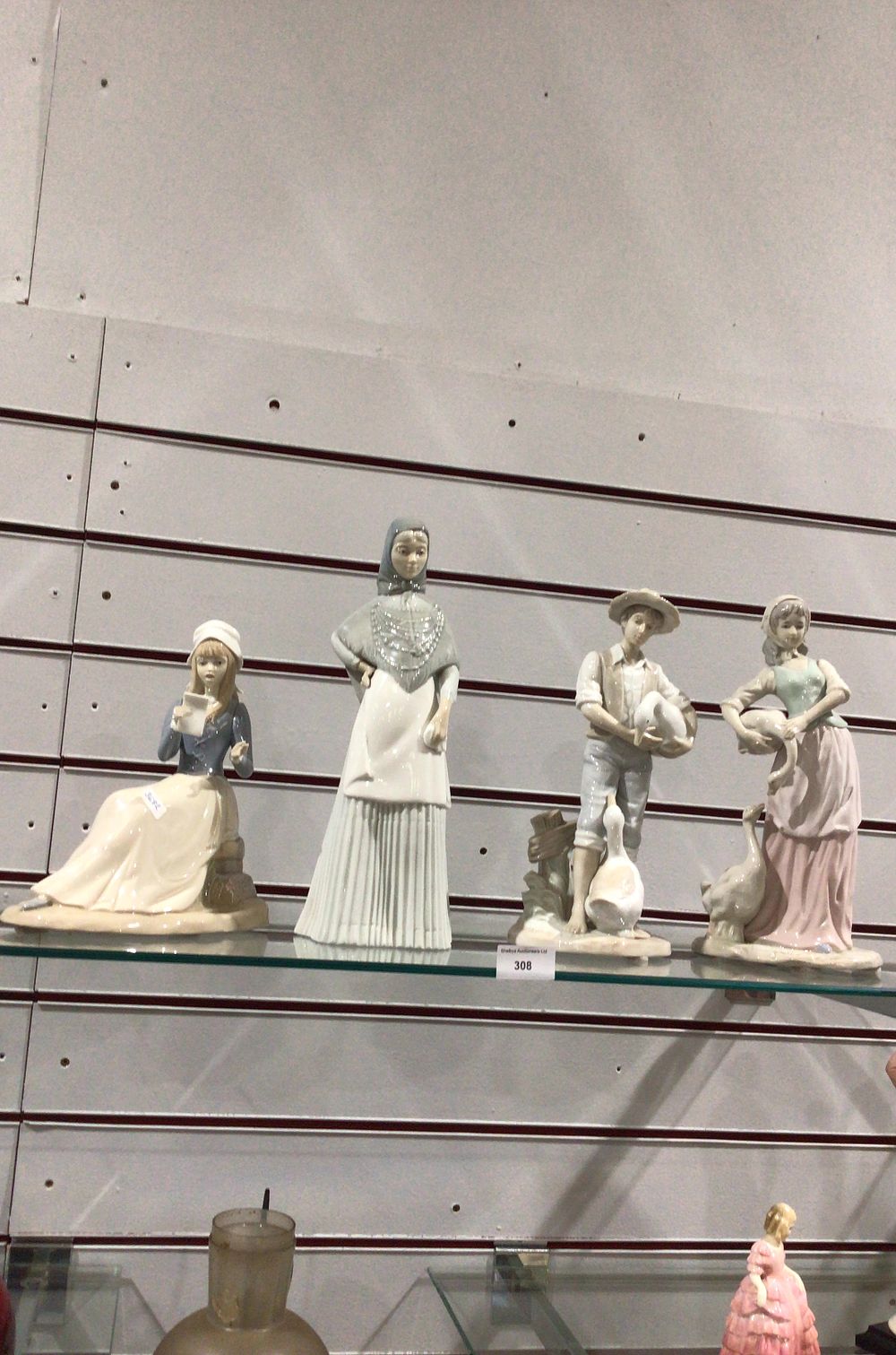 Lot 308: Grouping of Foreign Pottery Figurines