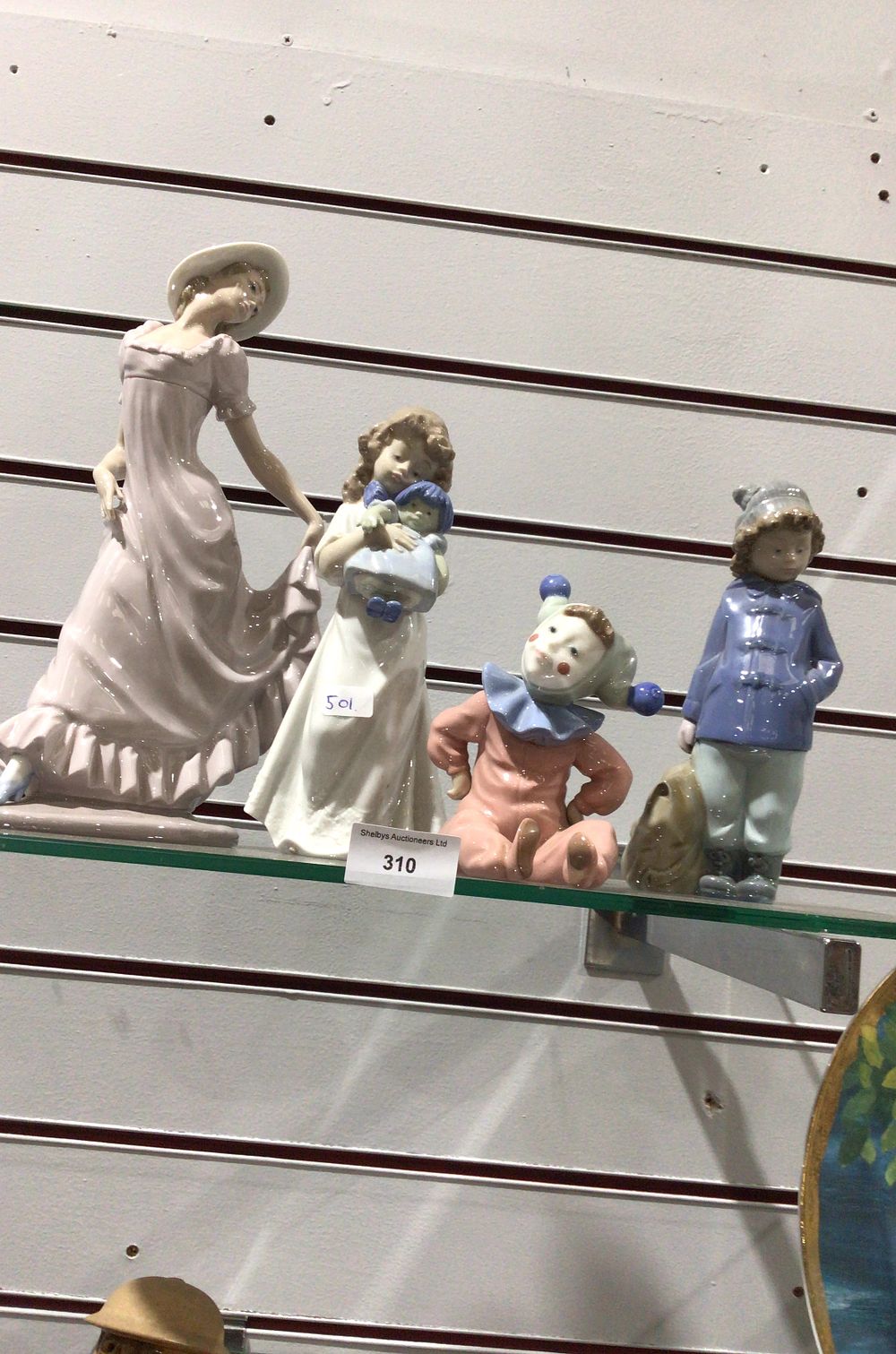 Lot 310: A Grouping of Lladro Porcelain Figures