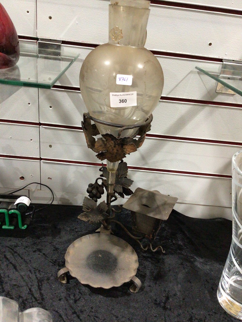 Lot 360: Decorative Metal Stand with Grape and Leaf Motifs and Glass Vessel