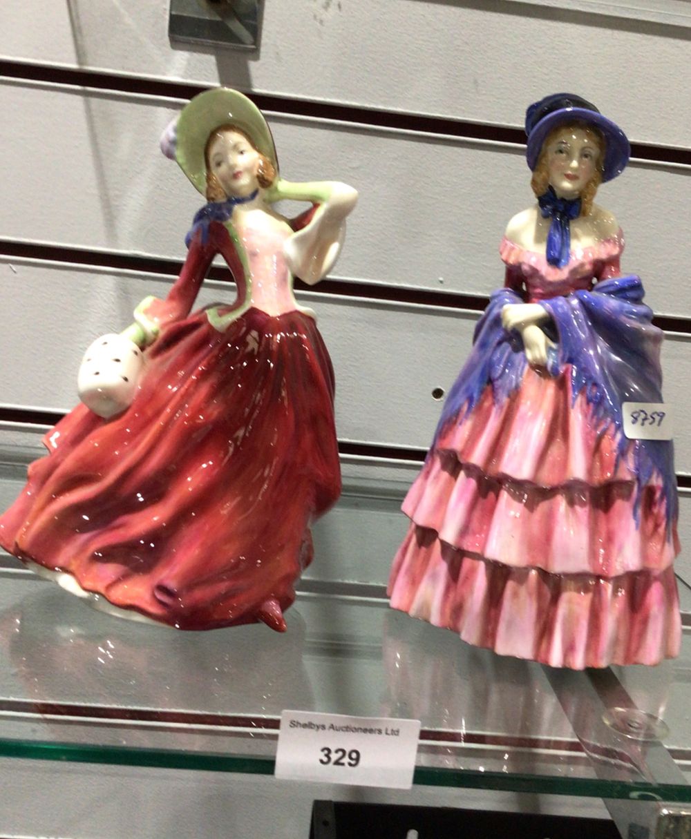 Lot 329: Royal Doulton 'Autumn Breezes' HN 1934 and Companion Figurine