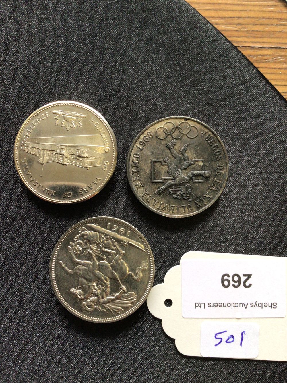 Lot 269: Coins commemorating, the 1968, Mexico Olympic Games, 1951 festival of Britain, five, shilling and 70 years of numismatic excellence