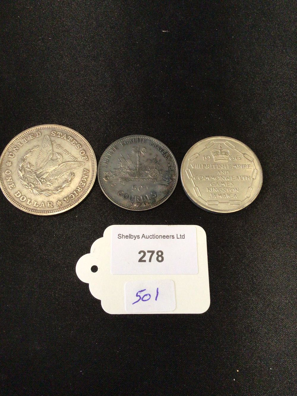 Lot 278: Three collectible coins, 1921 Morgan dollar, Canadian shilling and Innsbruck, Winter Olympics commemorative coin