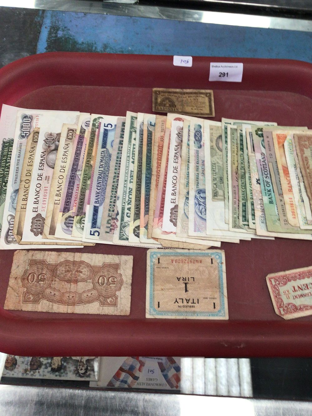 Lot 291: Tray containing various foreign and British banknotes, Spain Malta et cetera
