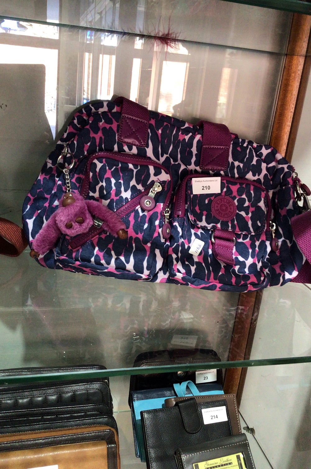 Lot 210: Kipling Leopard Print Shoulder Bag with Monkey Keychain