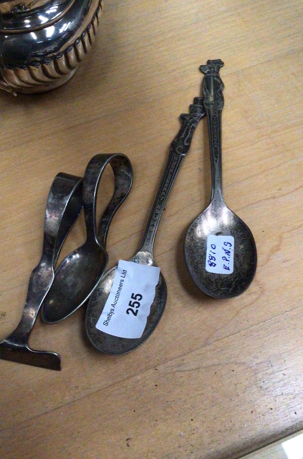 Lot 255: An Epns huckleberry hound spoon with yogi bear spoon and two other spoons