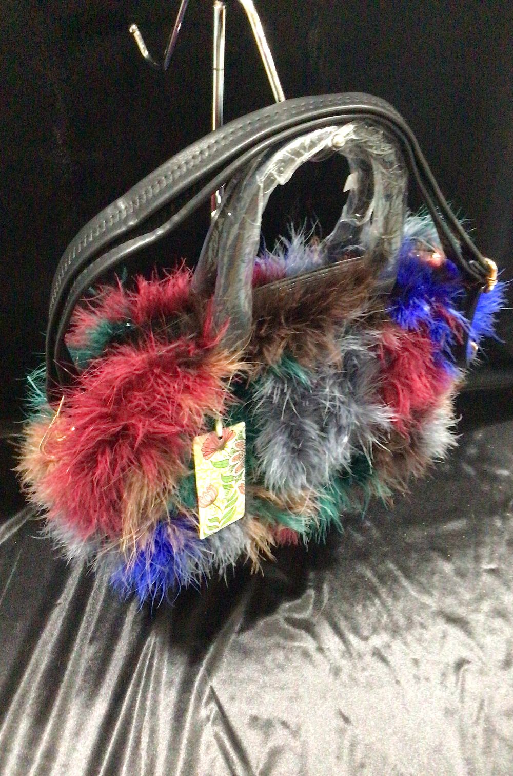 Lot 209: Feather Embellished Handbag with Black Handles and Strap