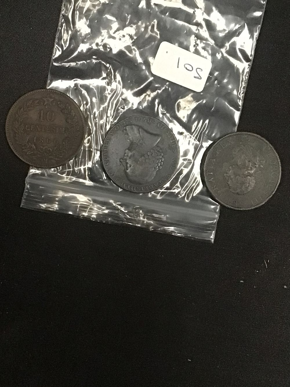 Lot 205: A Group of Three Assorted Coins and Tokens