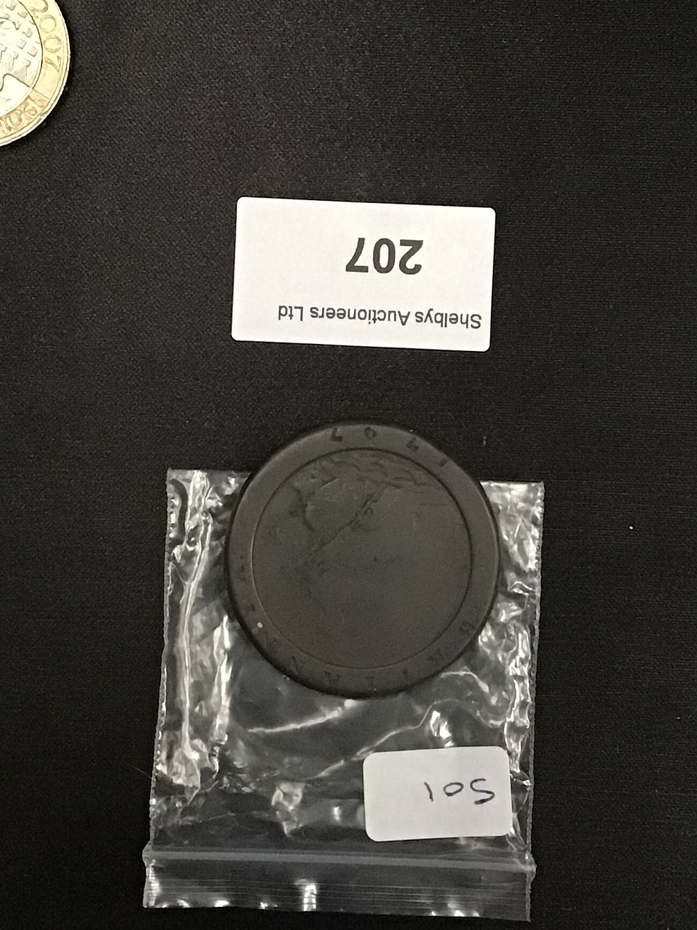 Lot 207: A Dark Circular Metal Coin or Medal