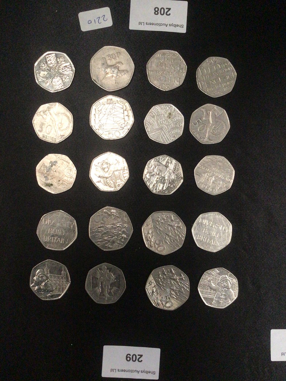 Lot 208: A Group of Twenty Various Silver-Colored 50 Pence Coins