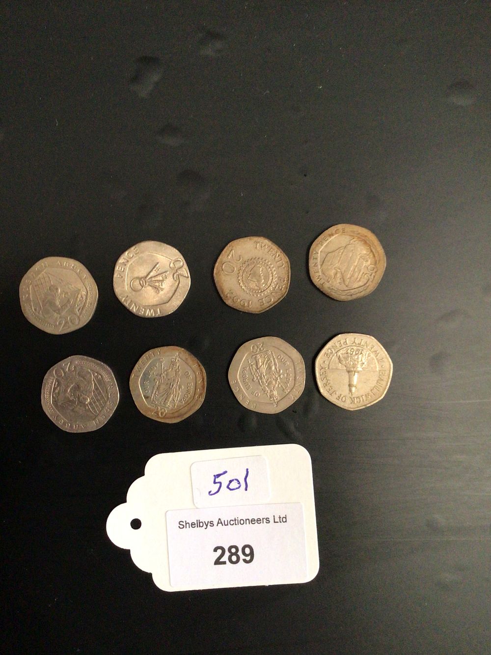 Lot 214: Eight. Various collectors 20p coins