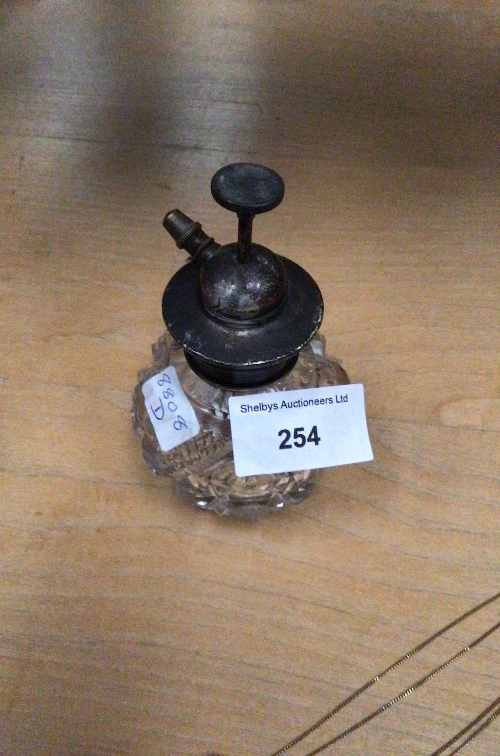 Lot 187: A Silver Topped Glass Perfume Atomizer