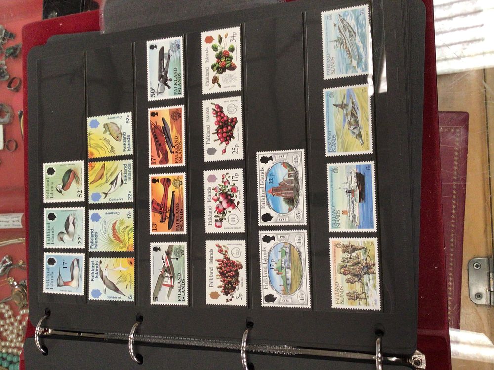 Lot 174: Stamp album containing Alderney, Guernsey, Falkland Islands, Isle...