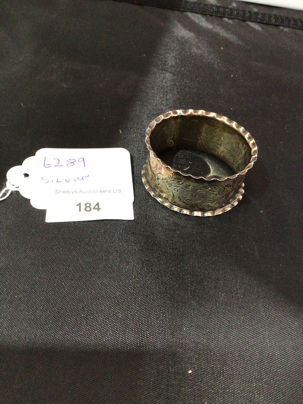 Lot 184: A Silver Engraved Napkin Ring, Birmingham Hallmarks