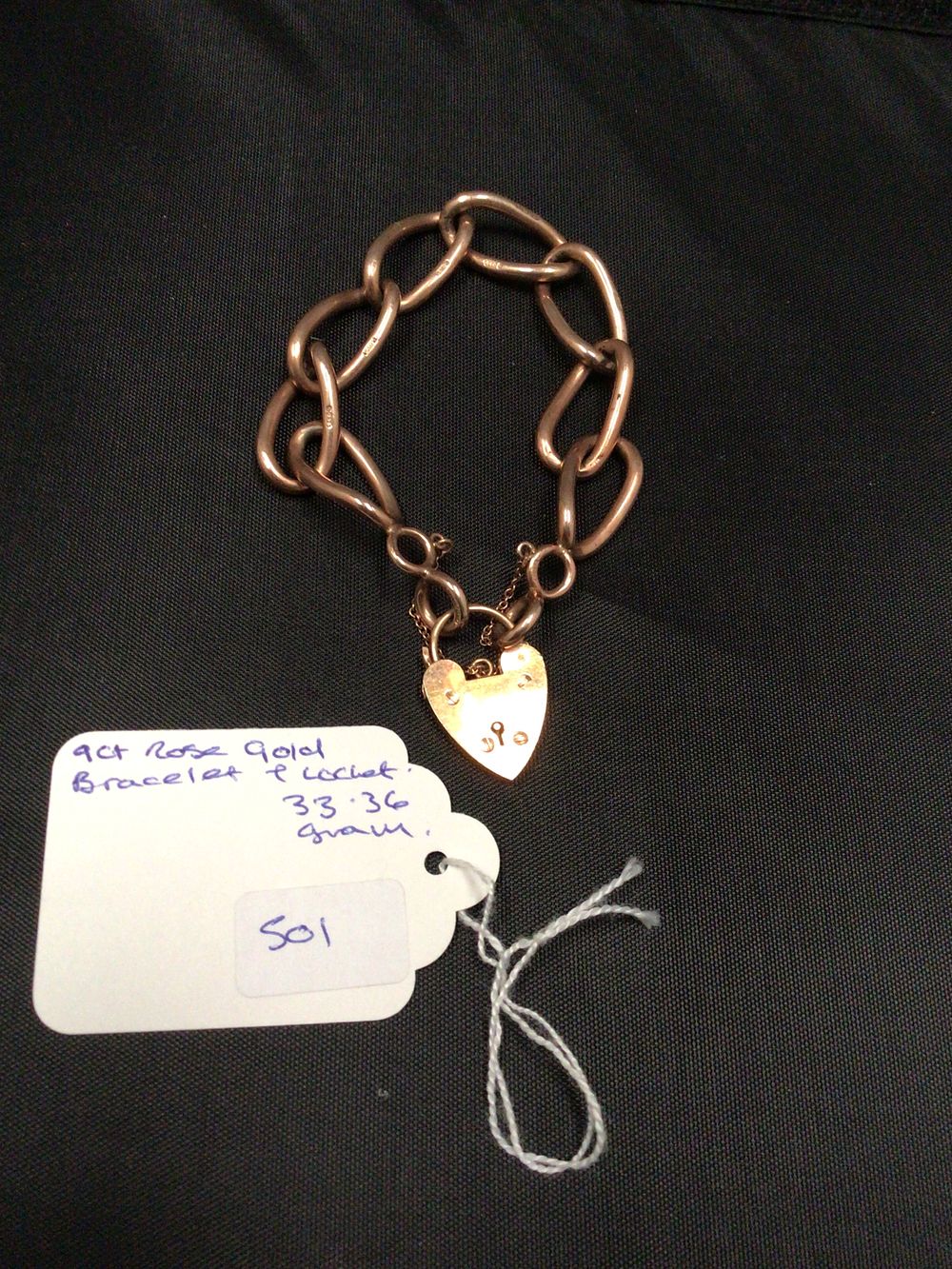 Lot 236: 9ct Rose Gold Curb-Link Bracelet with Heart Padlock