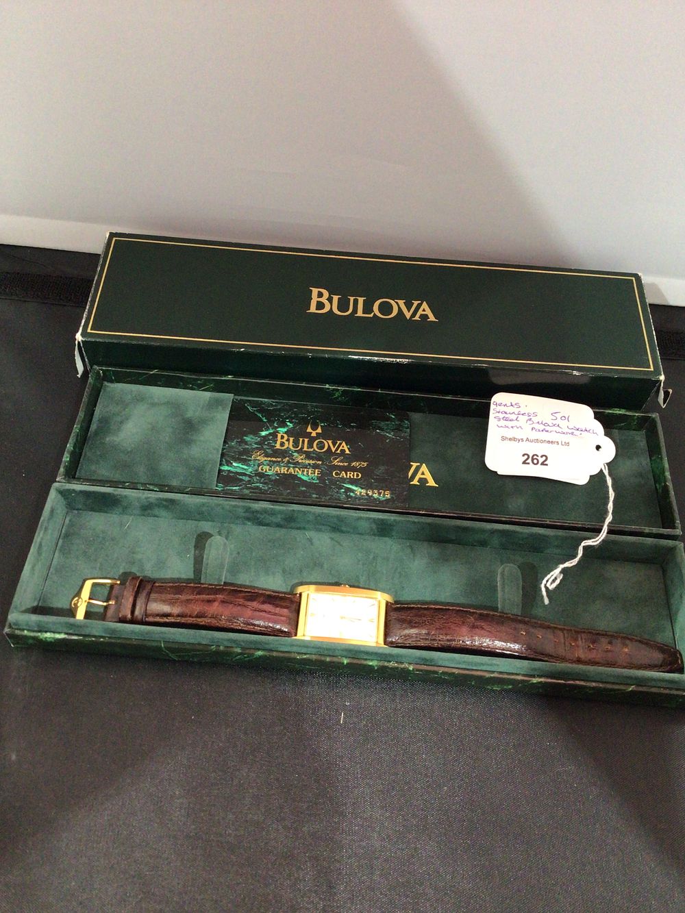 Lot 262: A Bulova Gold-Tone Quartz Wristwatch with Box