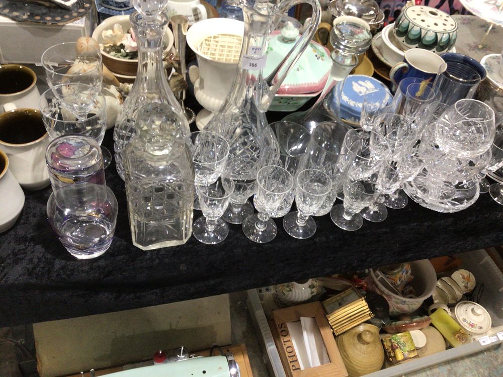 Lot 306: A selection of various crystal drinking glasses and decanters