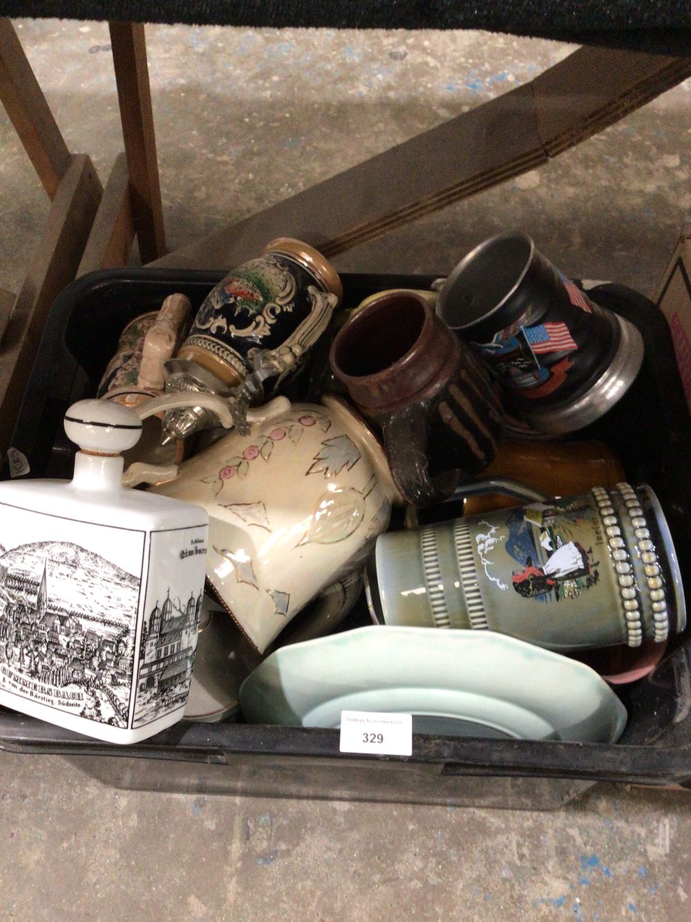 Lot 329: A Group of Assorted Ceramic and Metal Drinkware and Plates