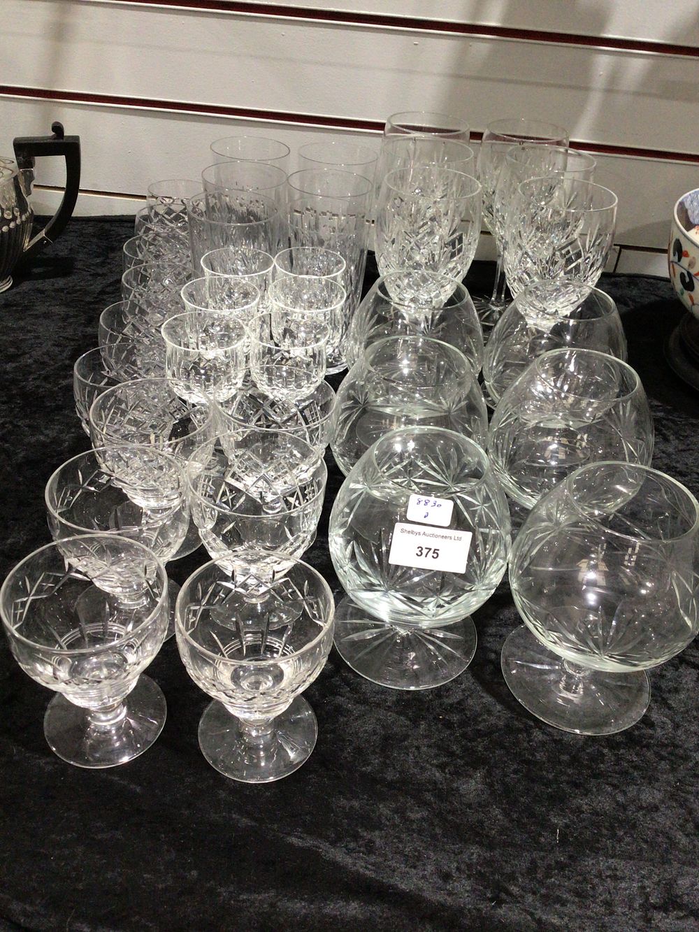 Lot 375: A large collection of clear cut crystal drinking glasses