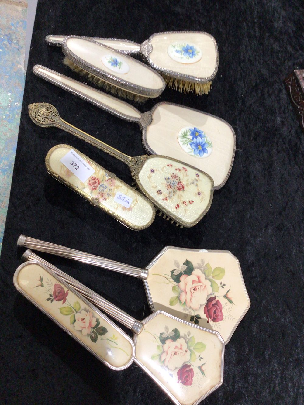 Lot 372: A selection of Two/ THree Piece Metal Petit Point Vanity Sets