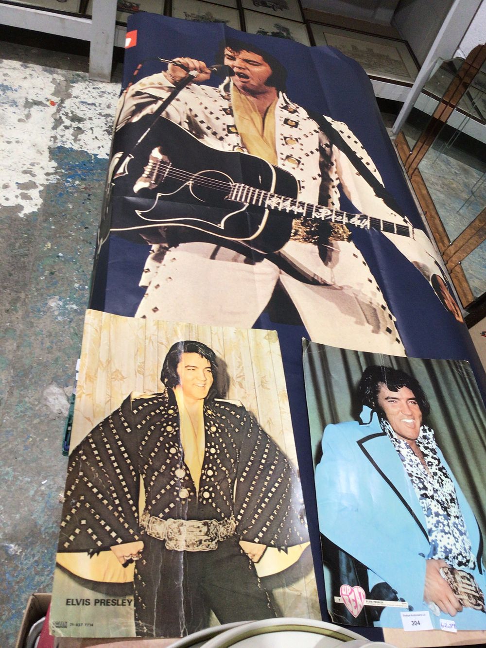 Lot 304: A Large Elvis Presley Poster with two smaller posters