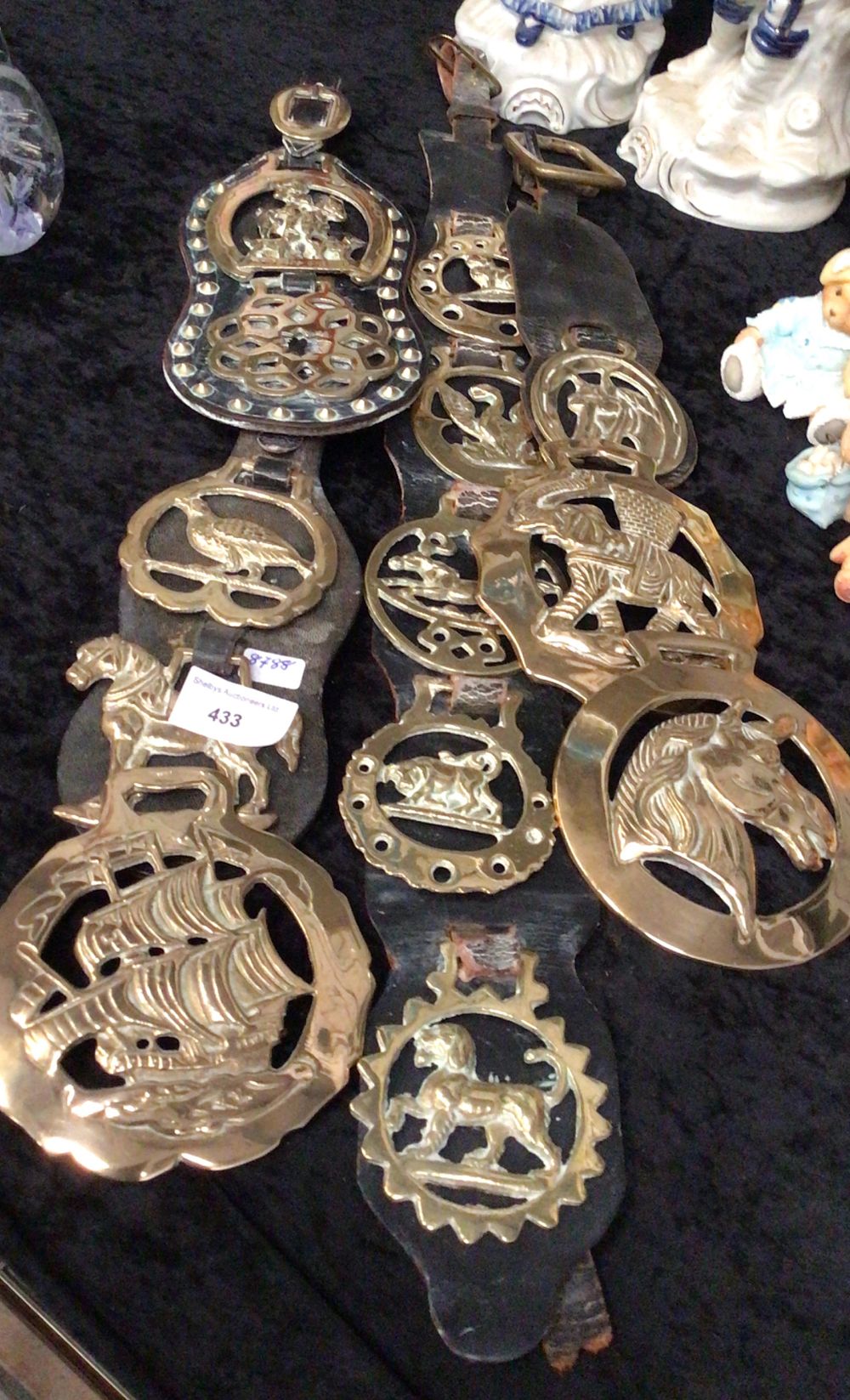 Lot 292: A Group of Three Vintage Horse Brasses on Leather Straps