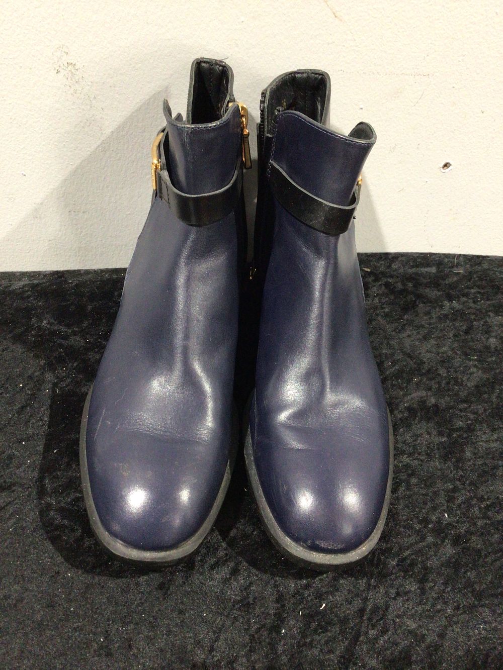 Lot 51: A Pair of Tod's Black Leather Ankle Boots