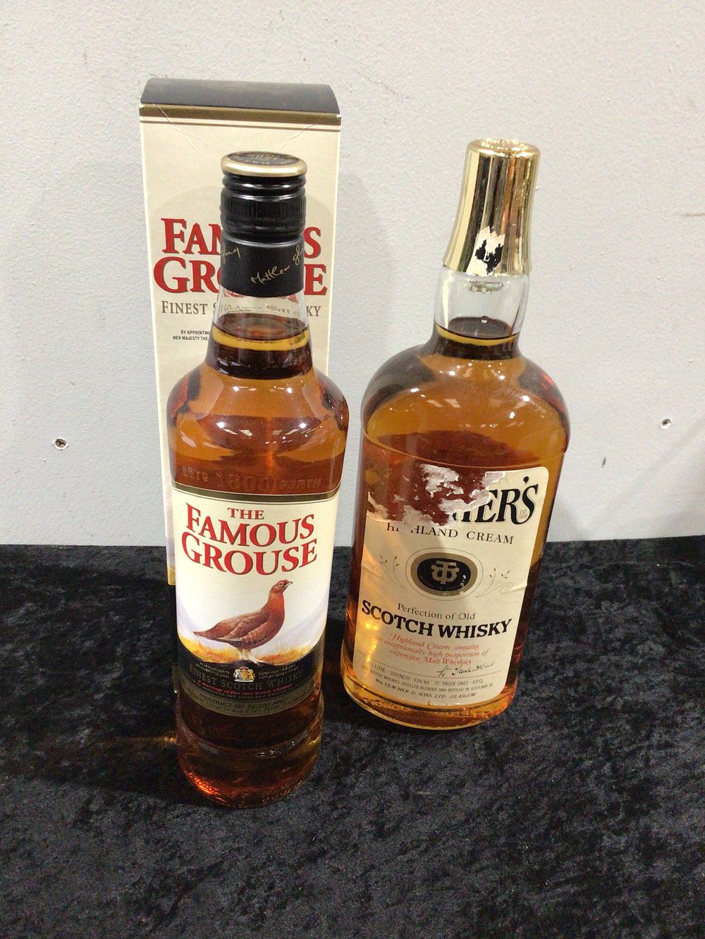 Lot 157: Two Bottles of Scotch Whisky, including The Famous Grouse and Teacher's Highland Cream