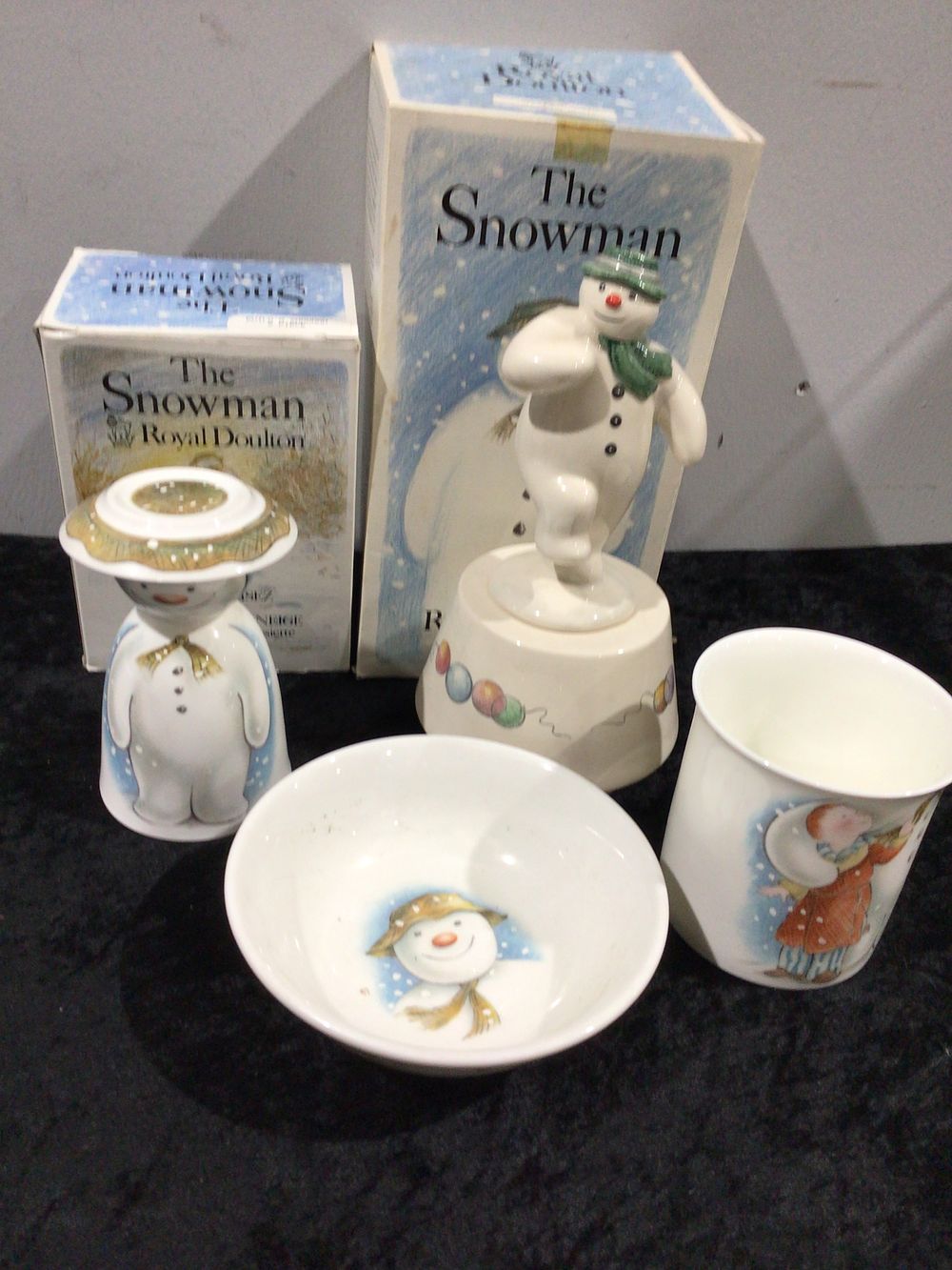 Lot 165: A Collection of Five Royal Doulton 'The Snowman' Ceramic Items, including a 'Snowman Magic DS5' Musical Figurine