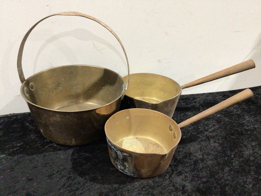 Lot 178: A Group of Three Antique English Copper and brass Jam Pan and Sauce Pans