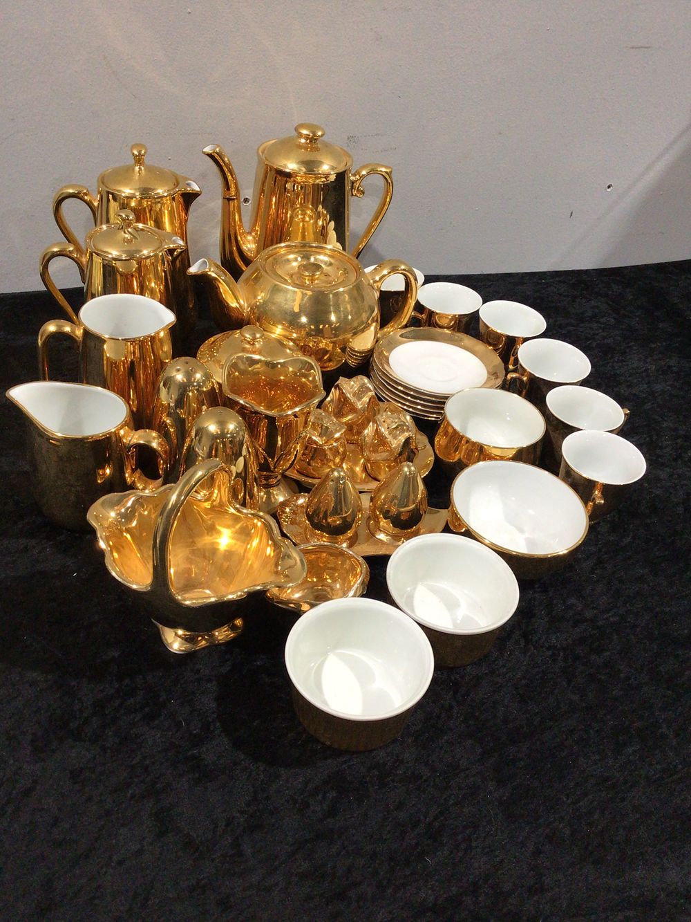 Lot 225: A Royal Worcester and Royal Winton Gold Tea, Coffee, and Dessert Service