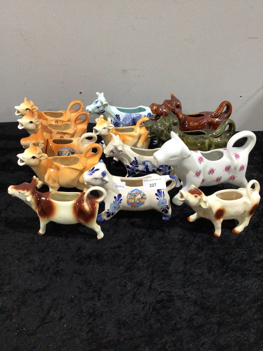 Lot 227: A Collection of Twelve Glazed Ceramic Cow Creamers, Diverse Designs